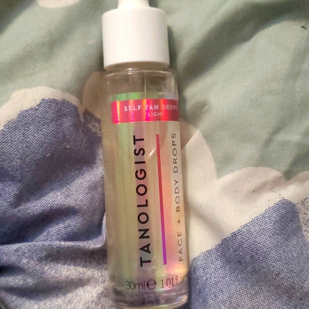 Tanololgist face and body drops